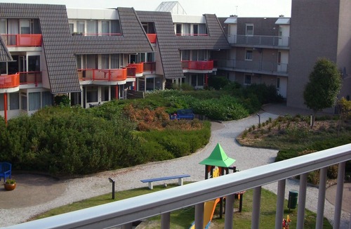 Municipality of Ameland Apartment | Ameland - apartment with balcony to the south side with a view of meadows and the village of Buren