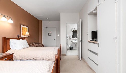 2 Single Beds with Half Washroom