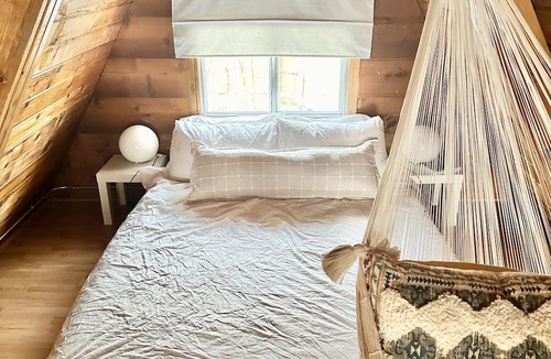 Division No. 10 Cabin | Techni Cabin offers a cozy A-frame blending rustic charm with modern comforts.